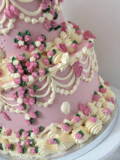 Close up of hand piped rosebuds and ivory Lambeth swags, custom cakes East London, Romford and Ilford.