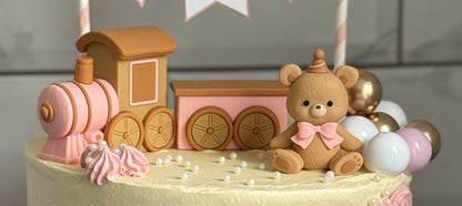 Close up of the toy train and teddy bear on top of the cake, custom cakes East London, Romford and Ilford.