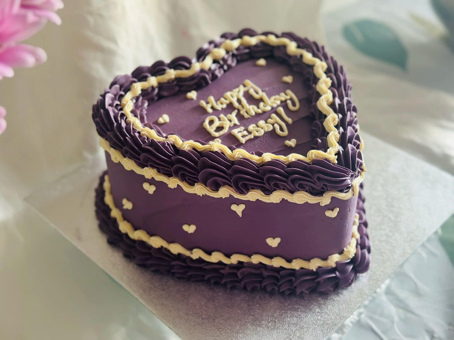 Purple heart birthday cake with mini hearts and piped buttercream, available for delivery in Chadwell Heath and Gidea Park.