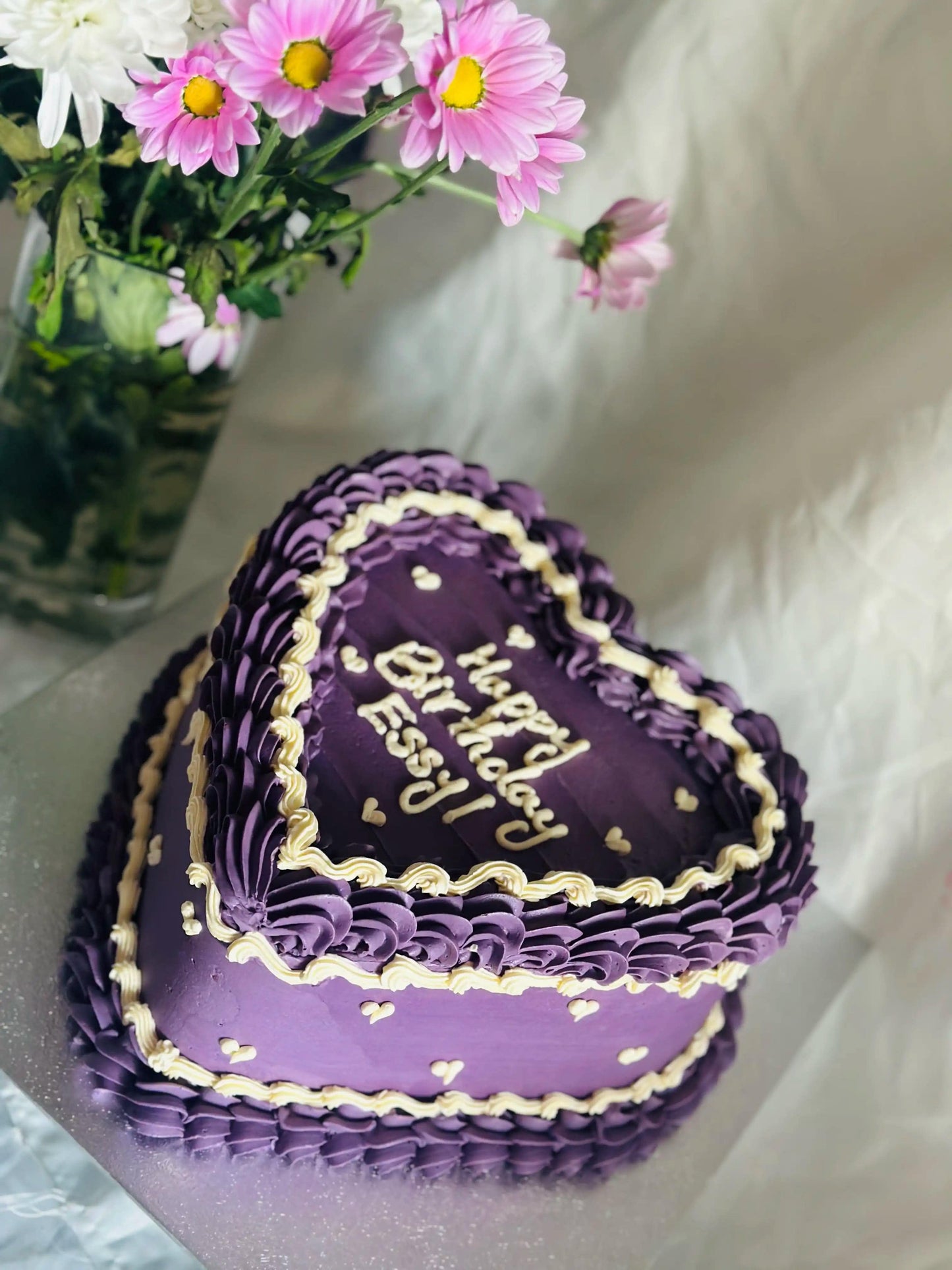 Purple Heart Cake with yellow piping and mini heart decorations, available for delivery in Walthamstow.