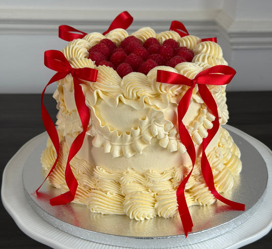 Vintage ribbon cake decorated with raspberries and bows – Ilford & Dagenham delivery