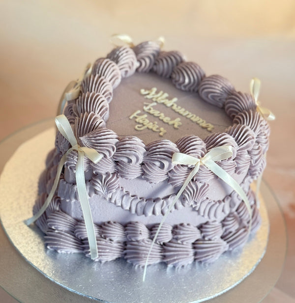 Ribbon piped heart cake with elegant lilac swirls delivered to IG7 Chigwell and RM5 Collier Row