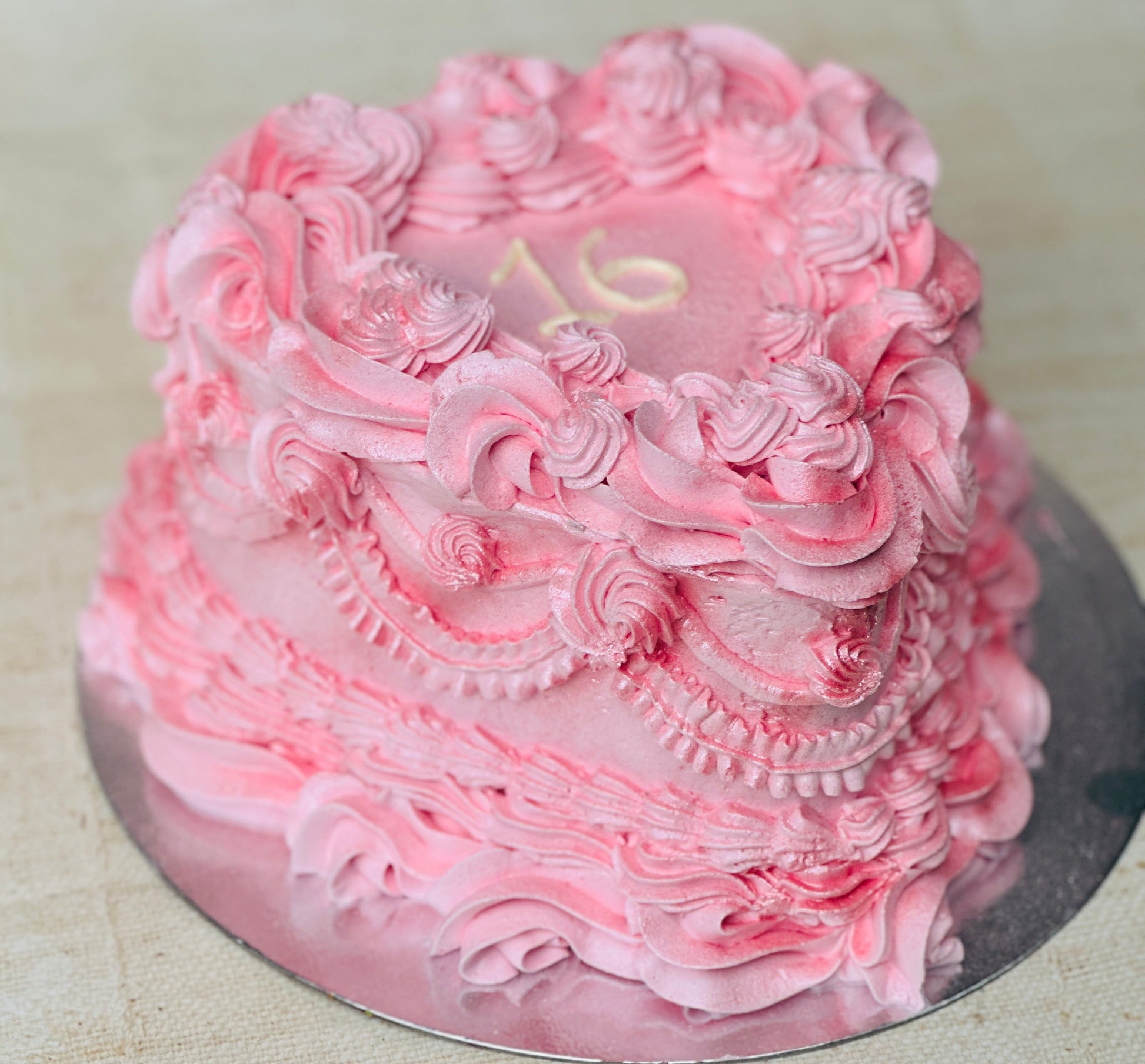 Same-day sweet sixteen heart cake delivery in Stratford and Walthamstow – handmade pink buttercream heart cake.
