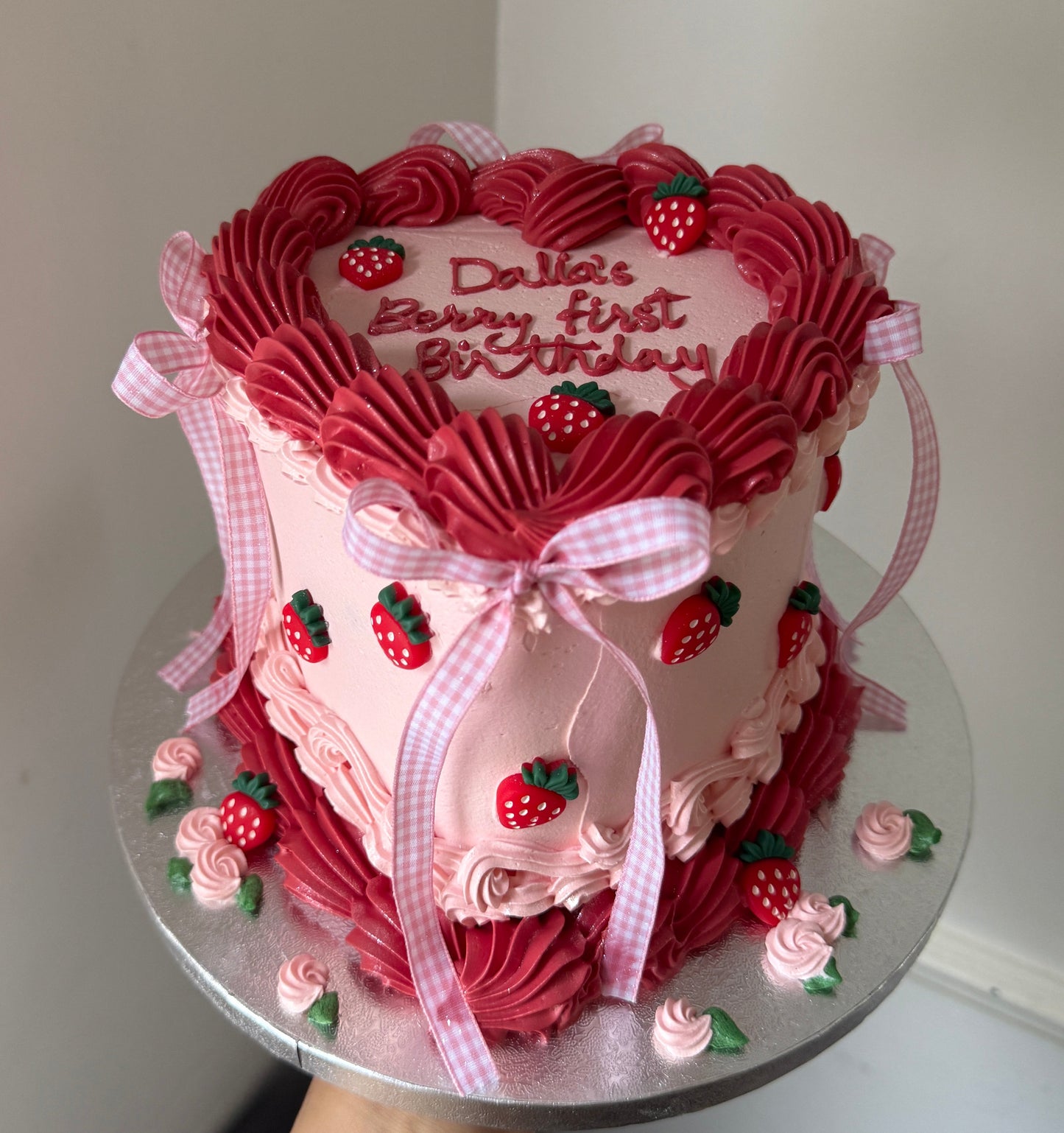 Pink vintage piped birthday cake decorated with strawberries and gingham bows — custom cakes East London, Romford and Ilford