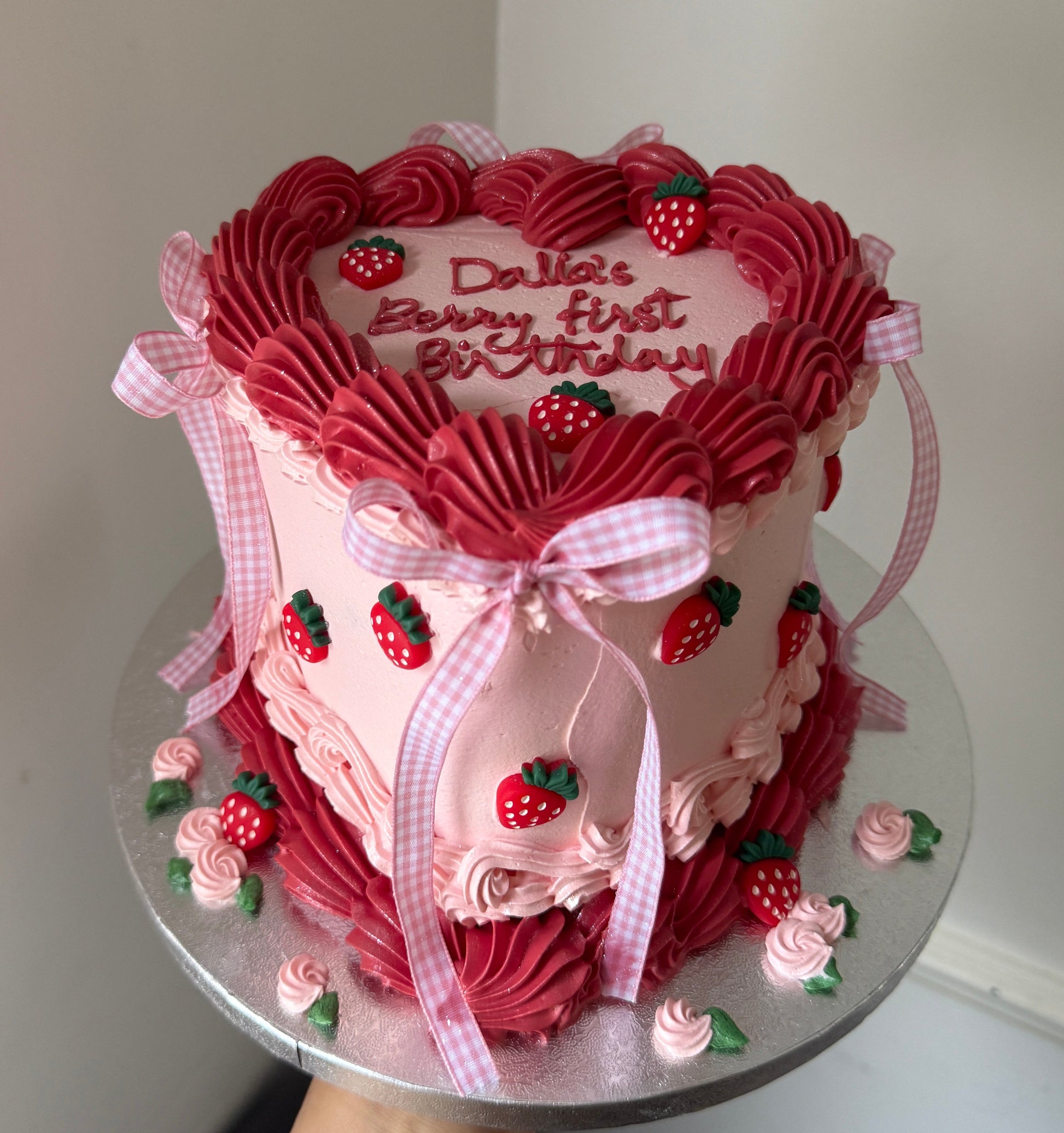 Pink vintage piped birthday cake decorated with strawberries and gingham bows — custom cakes East London, Romford and Ilford