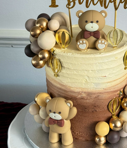 Close up of teddy bear topper on ombre first birthday cake, custom cakes East London, Romford and Ilford.