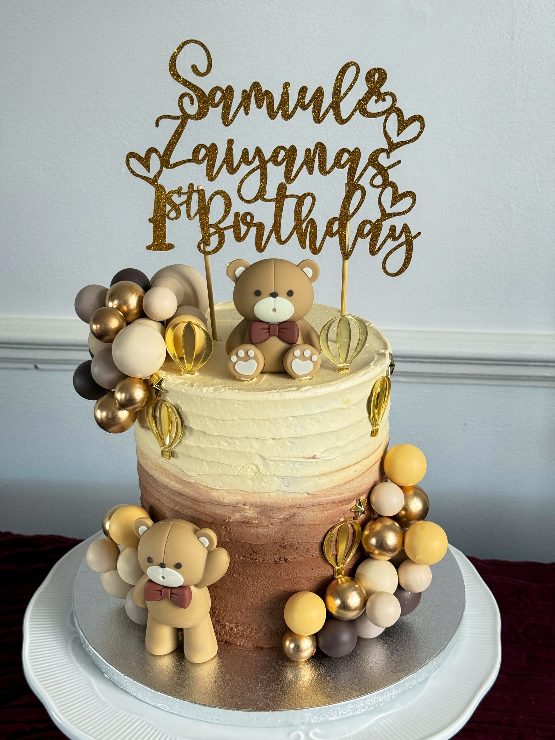 Teddy bear first birthday cake with ombre buttercream and balloon detailing, custom cakes East London, Romford and Ilford.