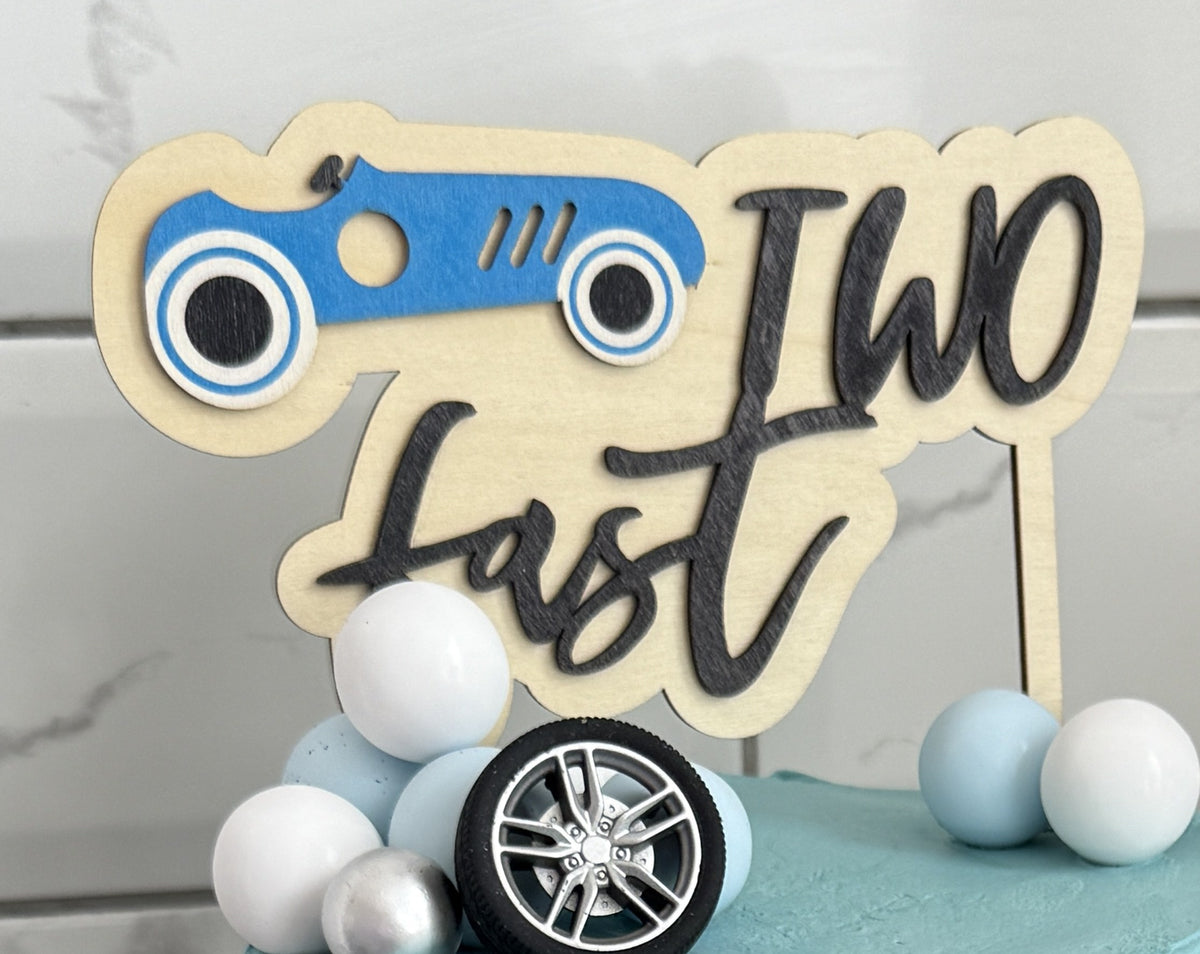 Close up of the Two Fast race car topper and tyres, custom cakes East London, Romford and Ilford.