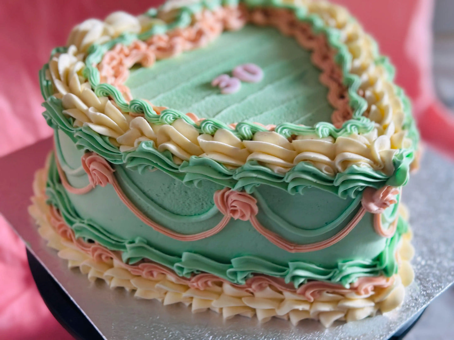 Vintage heart cake with nostalgic buttercream roses, freshly baked for you by CakeTrays.co.uk