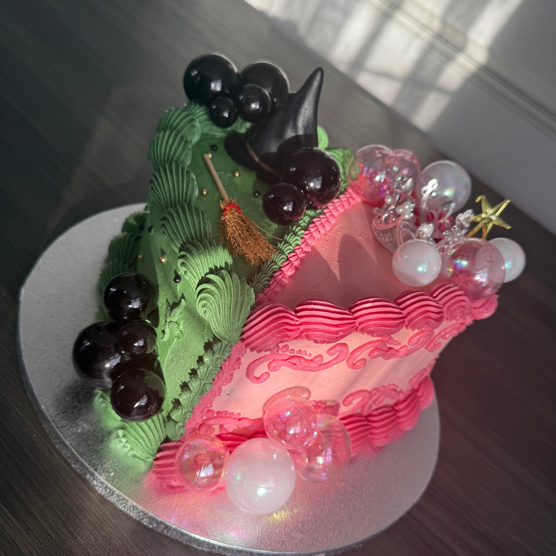 Wicked themed birthday heart cake half witch half princess design for same day delivery in Barking and East Ham