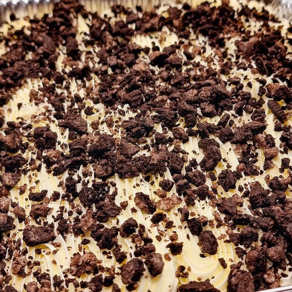 Oreo Milk Cake Tray topped with crushed Oreo biscuits, creamy dessert available for delivery in Romford, Ilford, and East London.