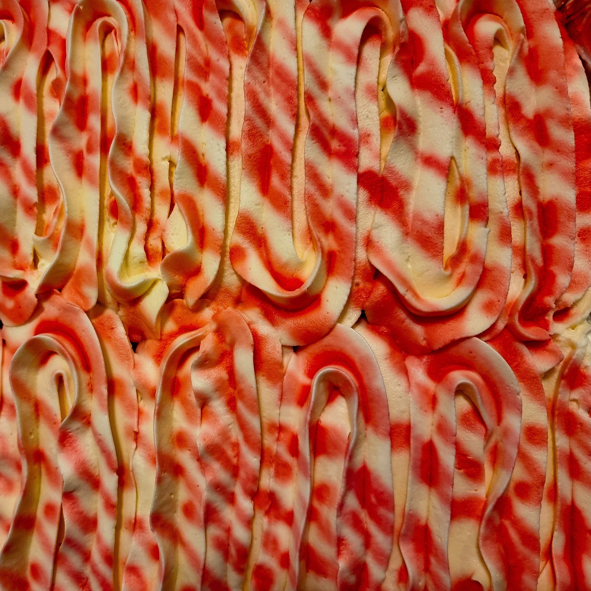 Close up of Rooh Afza milk cake tray showing syrup drizzle detail available for delivery in Dagenham and Barking.