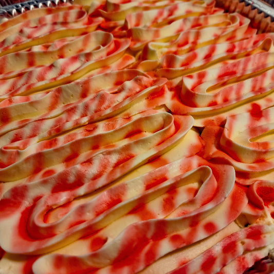 Rooh Afza milk cake tray topped with red syrup swirls available for same day delivery in Romford, Ilford and East London by Cake Trays.